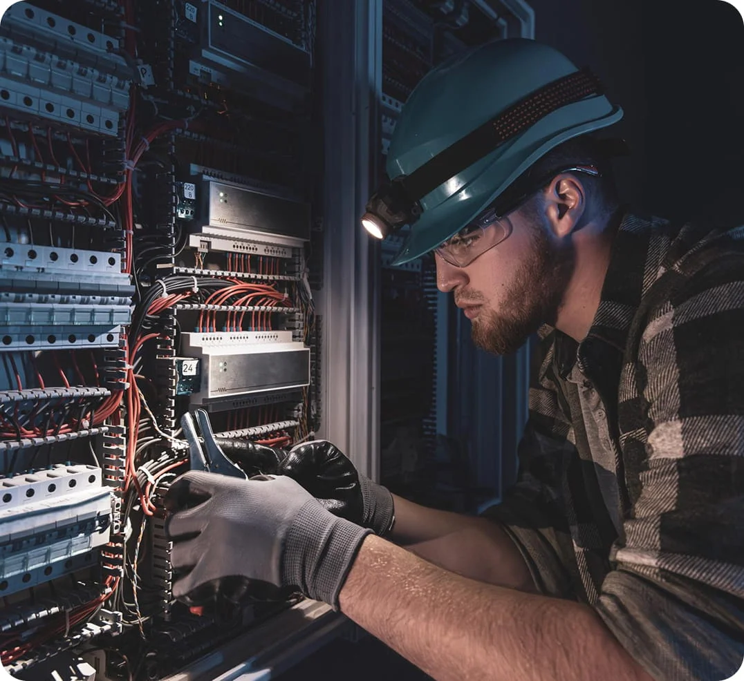 Electrician working on an electrical panel